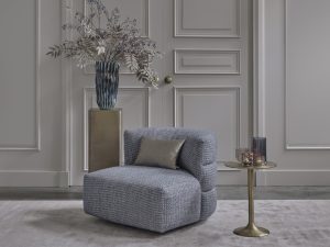 Lois armchair upholstered in Terni 01 fabric with beige and teal tones, available at Room 108